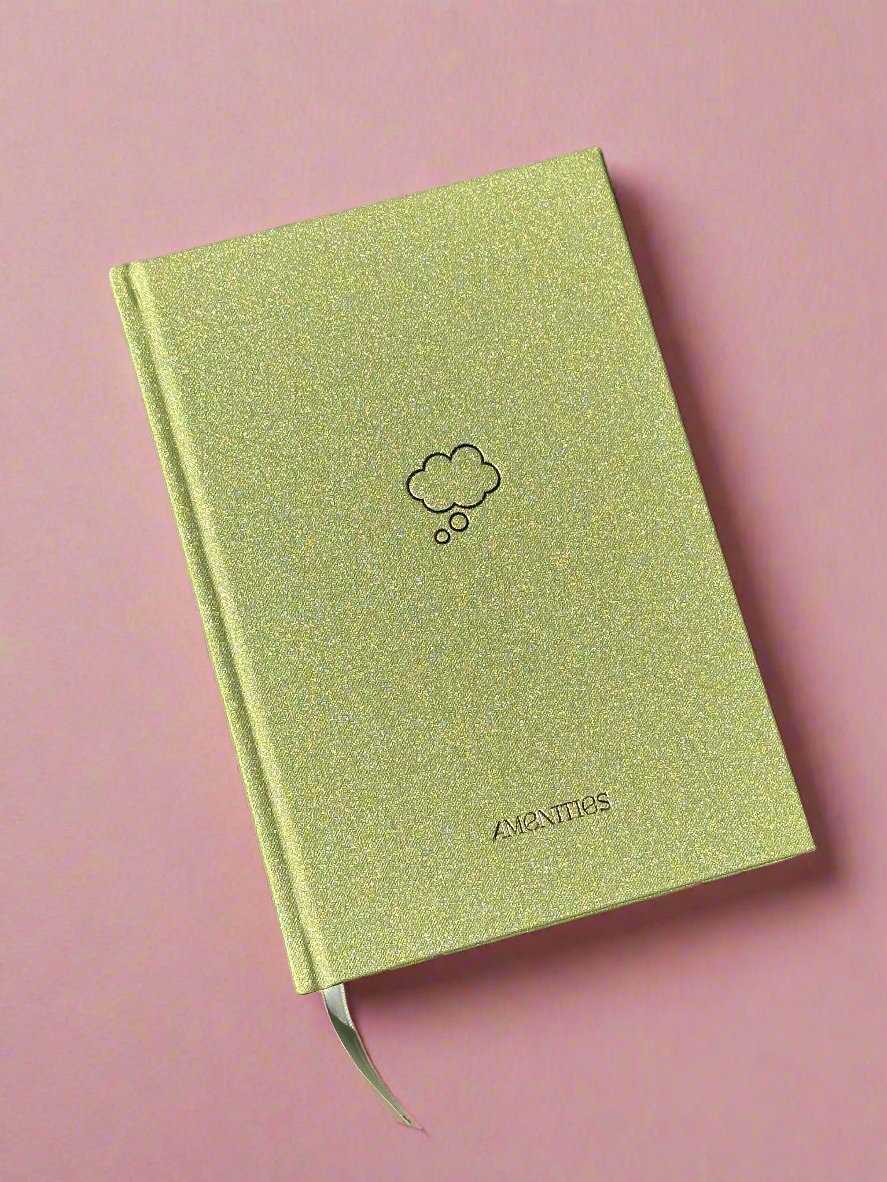Shimmering green journal with minimalistic thought bubble gold foil and book mark ribbon